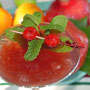Cherries and mint floating atop a cocktail
